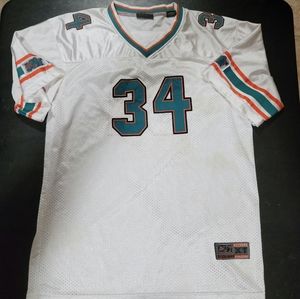 Ricky Williams Extreme Athletics play on the Miami Dolphins jersey.